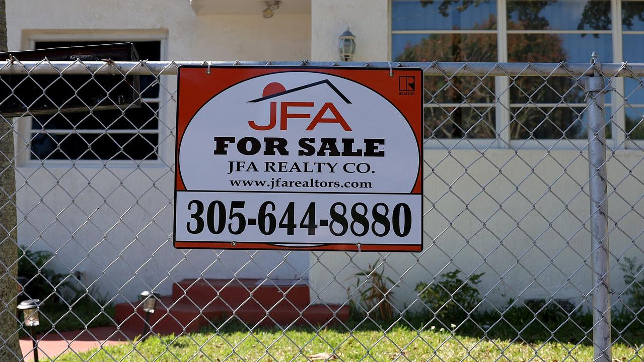 A For Sale sign displayed in front of a home in February in Miami, Florida. Picture: AFP