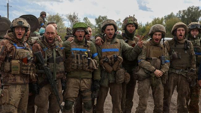 Ukrainian soldiers sing songs of victory in the Donetsk region. Picture: Anatolii Stepanov / AFP