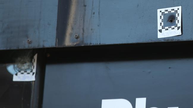 Bullet holes in the City of Ink signage. Picture: David Crosling