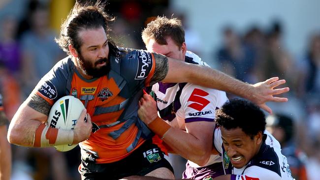 Tigers captain Aaron Woods takes on the Storm defence at Leichhardt Oval. Picture: Gregg Porteous