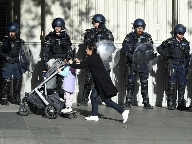 Riot police stand watch. Picture: Andrew Henshaw