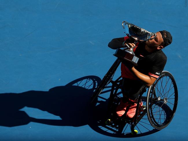 Dylan Alcott of Australia poses with the championship trophy