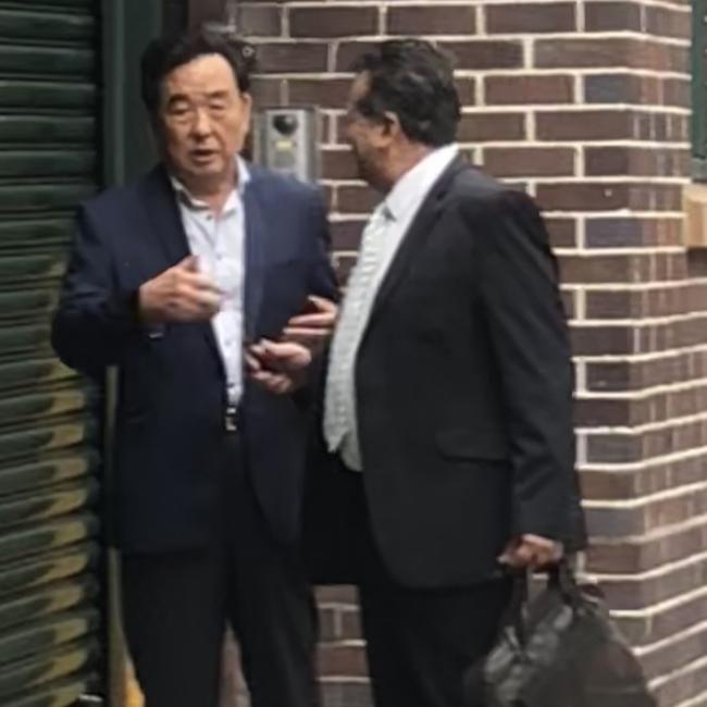 Ji Qing Liu, (left), 61, of Beacon Hill, speaking with his lawyer on Wednesday. Picture: Manly Daily.