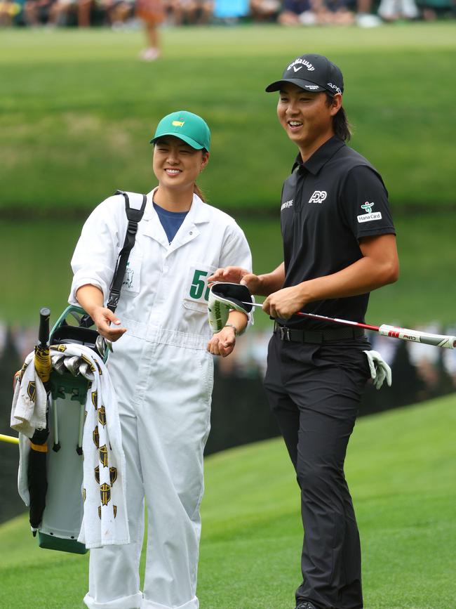 Minjee caddying for Min Woo during the Par Three Contest prior to the Masters at Augusta in 2022. Picture: Andrew Redington/Getty Images/AFP