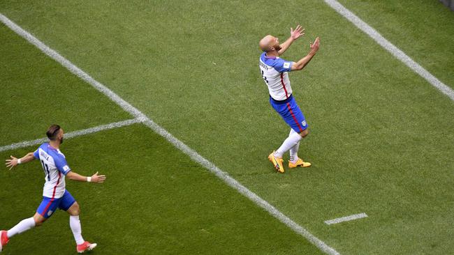 The USA's Michael Bradley (R) celebrates after scoring a goal against Mexico