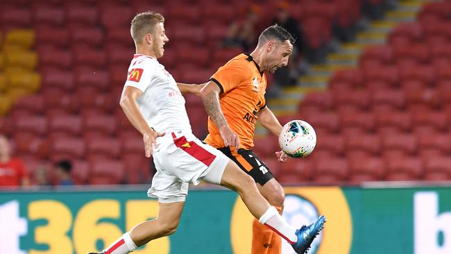 Adelaide’s Stefan Mauk battles with Brisbane’s Scott McDonald in February. Picture: AAP Image/Dan Peled