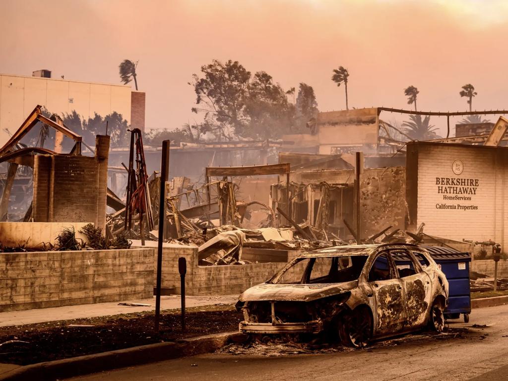 AFTER: A Berkshire Hathaway office is left in smoldering ashes during the Palisade fire in the Palisade village area Pacific Palisades. Picture: AFP via Getty Images