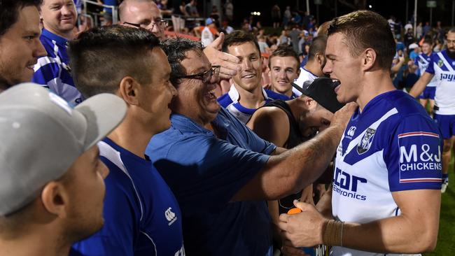Kerrod Holland is congratulated by his father Mick after kicking the winning conversion.