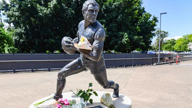 Flowers at the Russell Ebert statue at Adelaide Oval. Picture: Brenton Edwards