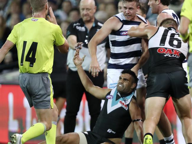 Tempers flare in front of the bench. Picture: Sarah Reed