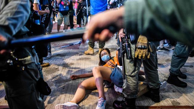 Police bring down a pro-democracy protester in Hong Kong earlier this month. Picture: AFP