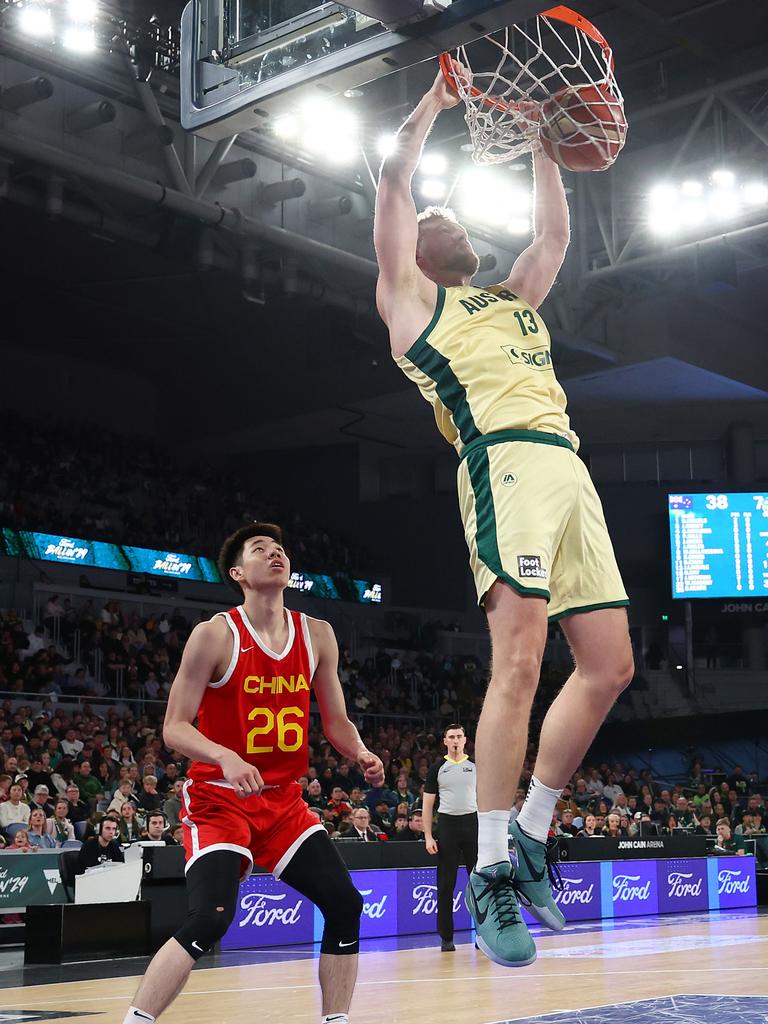 Jock Landale slam dunks in the win against China. Picture: Graham Denholm/Getty Images