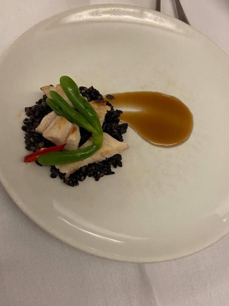 The entree of grilled crocodile tail with black rice and karkalla, a succulent you might recognise from your local beach. Picture: Lauren McMah