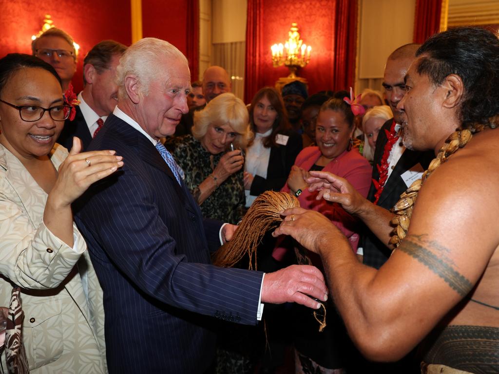 King Charles III reacts alongside Queen Camilla as former Samoan rugby player Freddie Tuilagi dances during a reception to celebrate the Commonwealth Diaspora. Picture: Adrian Dennis - WPA Pool/Getty Images