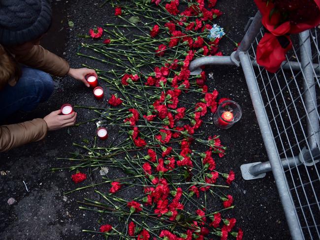 People lay flowers in front of the Reina nightclub on January 1, 2017 in Istanbul. Picture: AFP