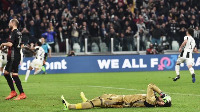 Milan's goalkeeper Gianluigi Donnarumma shows his dejection