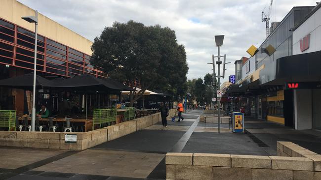 The delivery drivers speed through the Box Hill Central shopping centre mall, where they wait to pick up food orders.