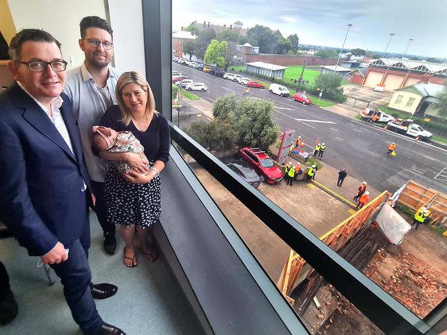 Premier Dan Andrews with parents Kahleah and Josh Lee and one day old Lexia. At ground level demolition works have begun for the Geelong hospital redevelopment. Picture: Alison Wynd