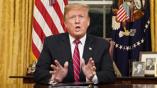 ‘This is a humanitarian crisis. A crisis of the heart, and a crisis of the soul’: Donald Trump addresses the nation from the Oval Office yesterday. Picture: AP