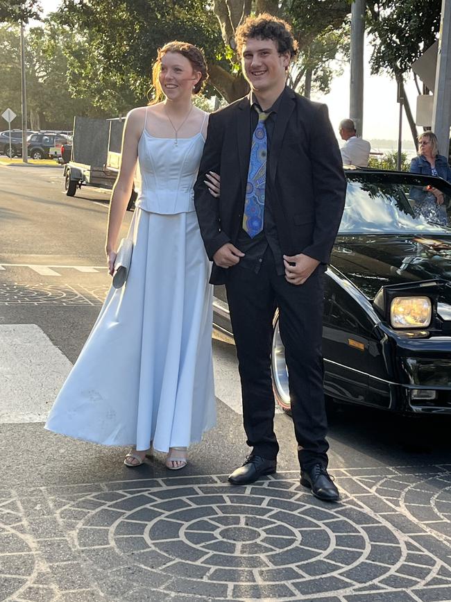 Marcia Breen, wearing her mum's wedding dress, and Noah Cain arrived at the formal in a 1986 Firebird Trans Am.