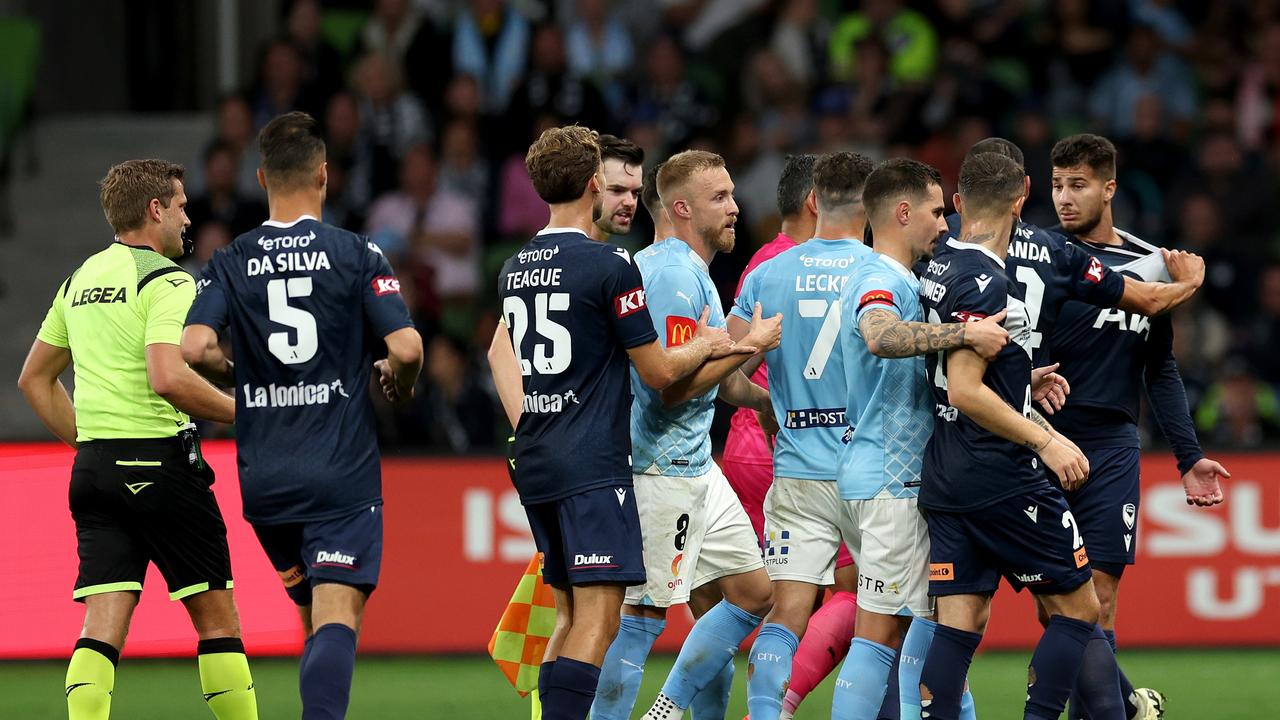 Players come together after Melbourne Victory’s Zinedine Machach (right) kicked out at Melbourne City’s Leo Natel. Picture: Jonathan DiMaggio/Getty Images