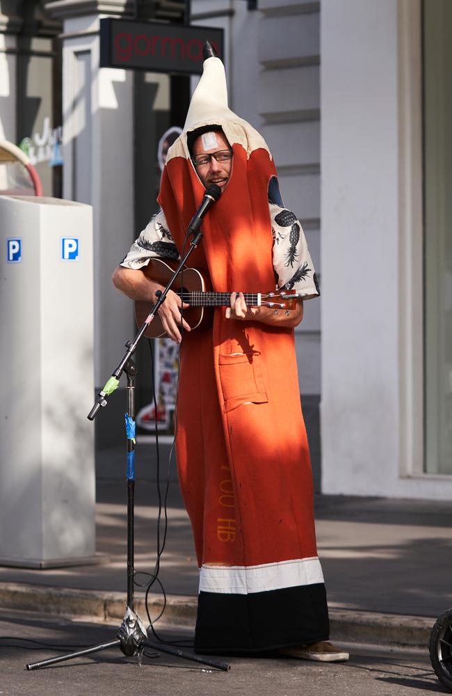 Matt Eberhart busking on Rundle St with a new ukulele. Picture: Matt Loxton