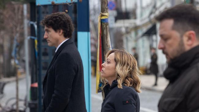 Canada's Prime Minister Justin Trudeau), Italy's Prime Minister Giorgia Meloni and Ukraine's President Volodymyr Zelensky at a wreath-lying ceremony at the Memory Wall of Fallen Defenders of Ukraine in Kyiv on Saturday. Picture: Ukrainian Presidential Press Service/AFP