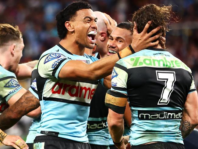 BRISBANE, AUSTRALIA - MAY 18: Ronaldo Mulitalo and Nicho Hynes of the Sharks celebrate a try during the round 11 NRL match between Cronulla Sharks and Sydney Roosters at Suncorp Stadium, on May 18, 2024, in Brisbane, Australia. (Photo by Chris Hyde/Getty Images)