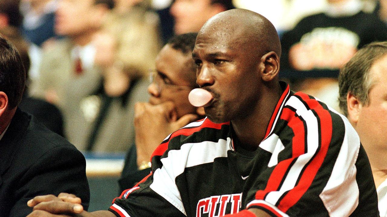 Chicago Bulls guard Michael Jordan watches the final minutes of the fourth quarter of the game against the Cleveland Cavaliers from the bench 11 November at Gund Arena in Cleveland, OH. The Cavaliers held Jordan to 19 points and six rebounds as they defeated the Bulls, 101-80. AFP PHOTO/Kimberly BARTH (Photo by KIMBERLY BARTH / AFP)