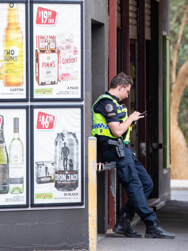 Police outside a bottle shop in Alice Springs