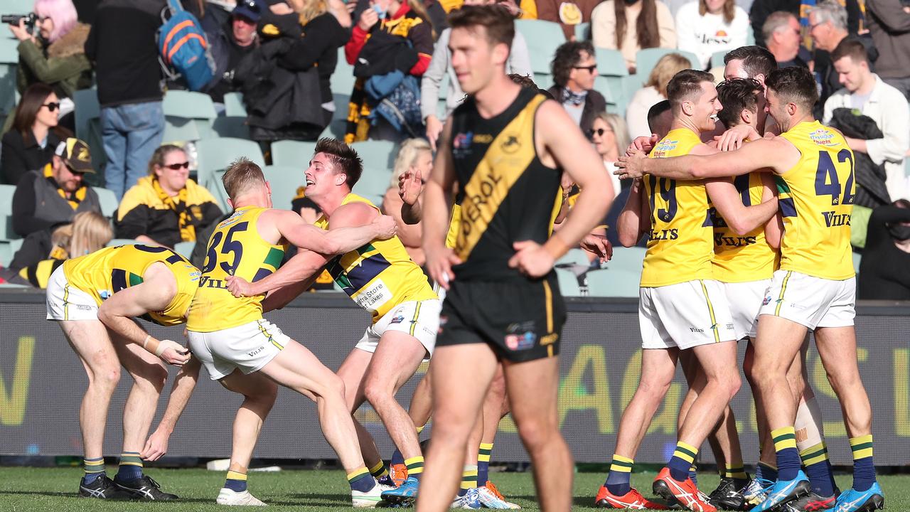 Woodville-West Torrens players celebrate their Grand Final win. Picture: Sarah Reed