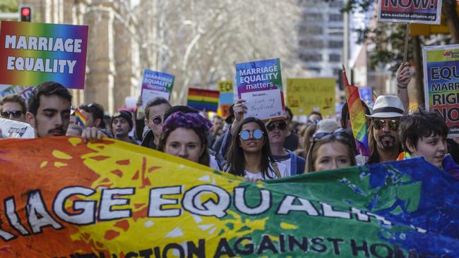 Protesters march through the Sydney CBD demanding recognition of same-sex marriage. Picture: Getty Images