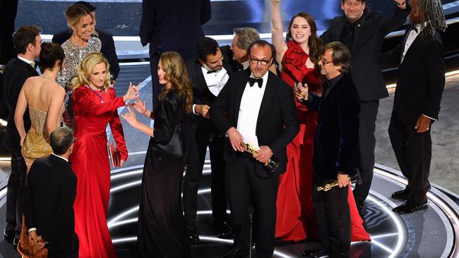 Cast and crew accept the award for Best Picture for "CODA". Photo by Robyn Beck / AFP