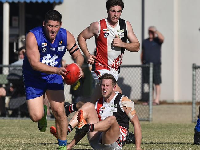 Brendan Fevola (left) of Hastings is seen in action during the MPNFL Div 2 match in Hastings, Melbourne, Saturday, April 20, 2019. MPNFL Div 2 v Devon Meadows V Hastings. (AAP Image/James Ross) NO ARCHIVING