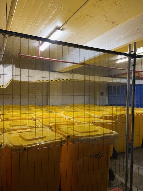 The moved bins containing quarantine hotel materials.