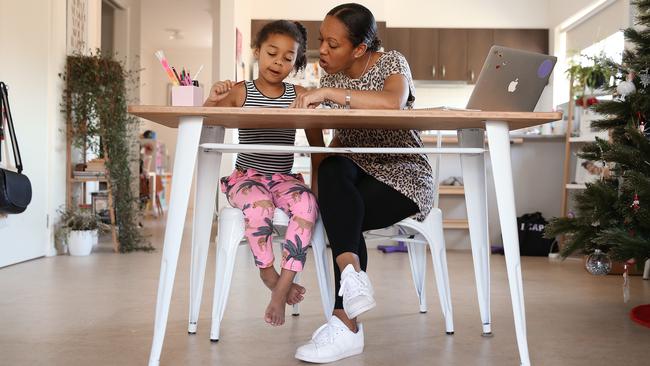 Heloise Cram teaches her daughter Neveyah, 6, what she considers real life skills. Picture: Sam Ruttyn