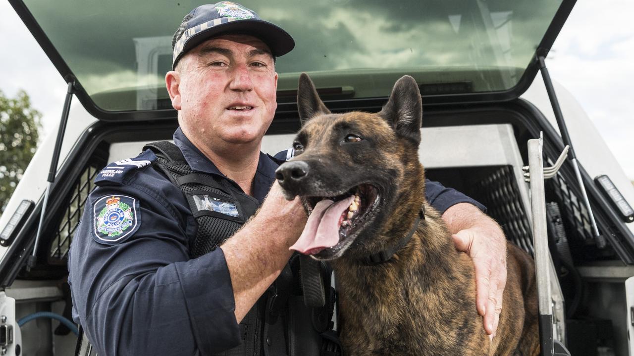 Officer-in-charge Toowoomba Dog Squad Sergeant Trevour O'Neil with Dutch shepherd PD Danko. The represent just one of the roles on offer for today’s police recruits. Picture: Kevin Farmer
