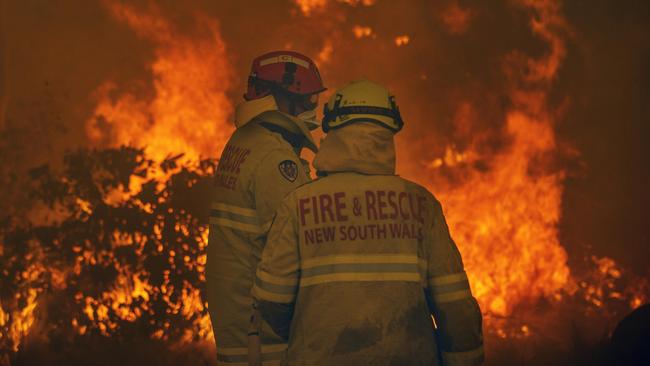 Firefighters worked desperately to save homes as the large fire approached Bawley Point, on the NSW South Coast last Thursday. Picture: Gary Ramage