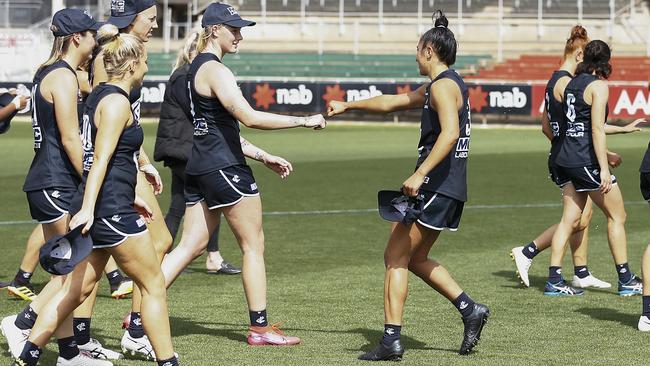 Darcy Vescio fist bumps with Tayla Harris after winning the semi-final against Brisbane. Picture: Getty