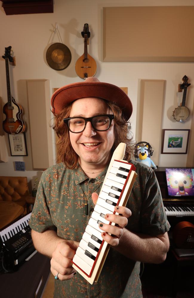 Bluey lead composer Joff Bush in his South Brisbane studio with the melodica which is used in the theme song to Bluey. Picture: Liam Kidston.