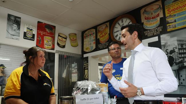 David Crisafulli and John Barounis LNP candidate for Maryborough talking with victim of crime Belinda Earle, Earles Paint Place, Maryborough. Picture: Liam Kidston