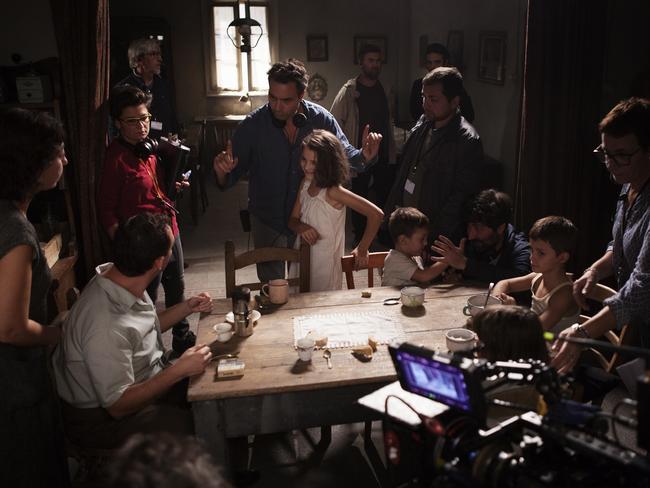 My Brilliant Friend in the centre, Saverio Costanzo &amp; Elisa Del Genio (young Elena) with the crew. Photo by Eduardo Castaldo