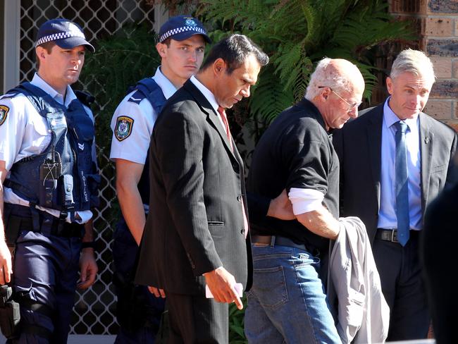 TV ARREST: Aaron Pedersen (centre) played an arresting detective in yesterday’s scenes. Picture: Ross Schultz