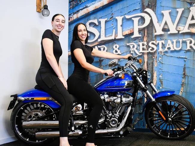 Ella and April McLennan of Lucinda Cove Resort sit atop an impressive $40,000 Harley-Davidson in the popular Slipway Bar and Restaurant fronting Enterprise Channel and Hinchinbrook Island. The motorbike is up for grabs to local and regional punters who spend at the restaurant or bar or stay at the motel, with the winning entry drawn on December 20 this year. Picture: Cameron Bates