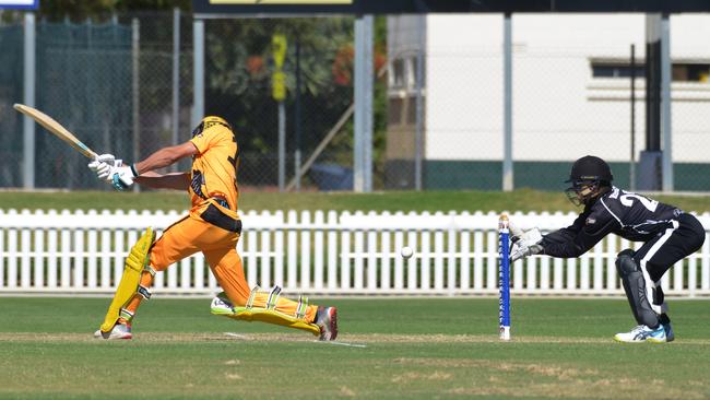 Glenelg's <b>Joshua Hoffmann </b>swings, edges and is caught behind for a golden duck by Adelaide University wicketkeeper <b>Daniel Kerber </b>on Saturday. Picture: AAP/Brenton Edwards