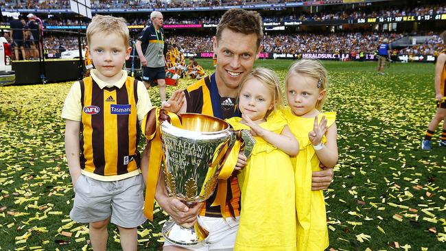 Sam Mitchell celebrates Hawthorn’s 2015 premiership with his kids. Picture: Michael Klein