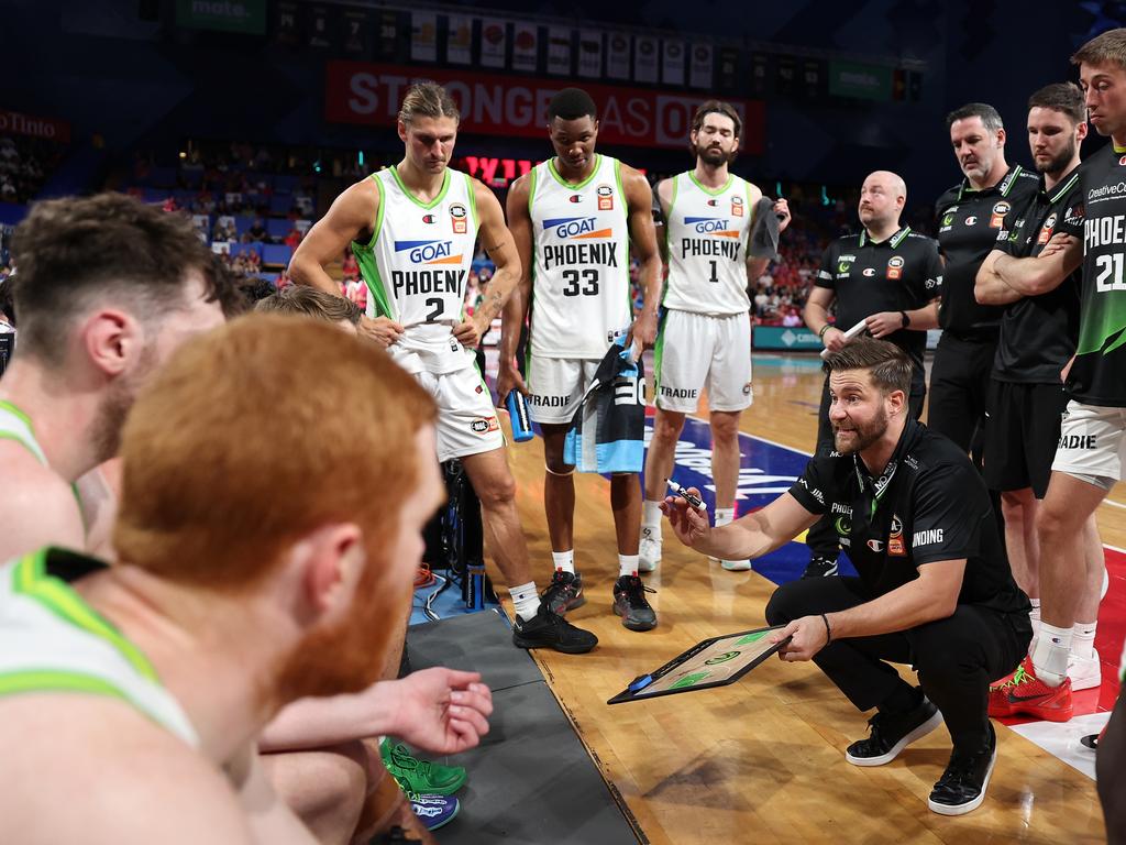 Josh King, head coach of the Phoenix addresses his players at a time-out. Picture: Getty Images