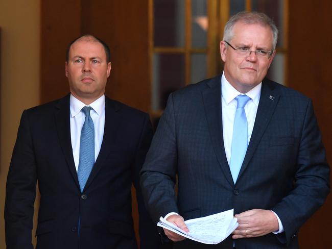 Treasurer Josh Frydenberg and Prime Minister Scott Morrison arrive to announce the government's $130b wage subsidy package on March 30.