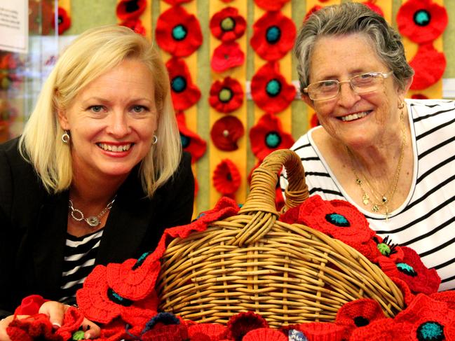 Cr Krista Adams with Lenore "Greta" Tanner. Greta sewed 300 poppies for the 5000 Poppies project in time for Anzac Day. They are pictured at Carindale Library in Brisbane, Australia.