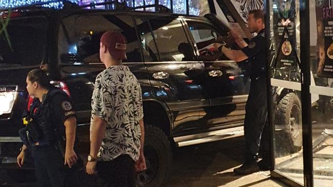 Emergency services workers on the scene soon after the 4WD was driven into the front of the Six Tanks pub on Mitchell St. Picture: Supplied